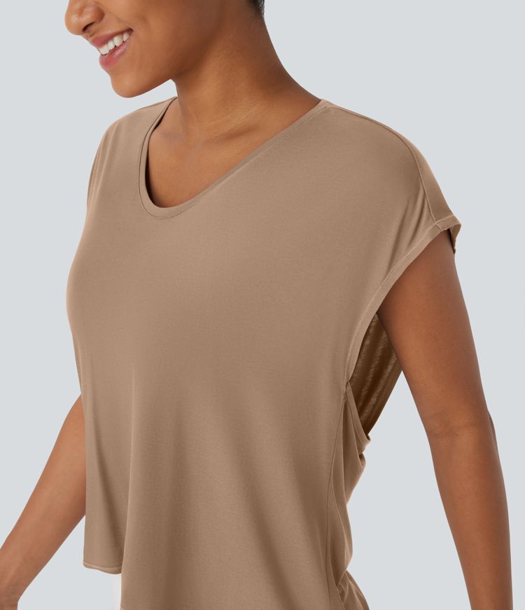 Top deportivo para running asimétrico con espalda cruzada y dobladillo asimétrico