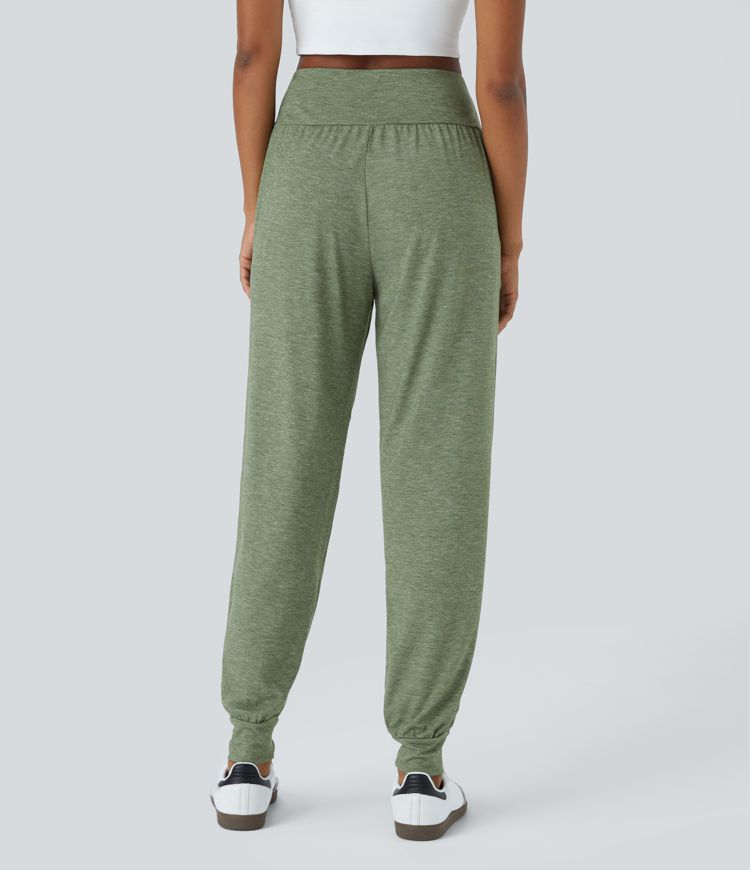 Pantalón deportivo tiro alto bolsillo lateral cruzado pliegue