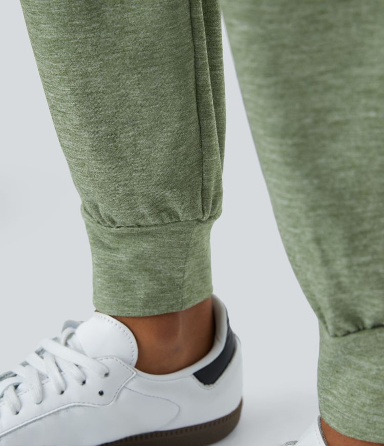 Pantalón deportivo tiro alto bolsillo lateral cruzado pliegue