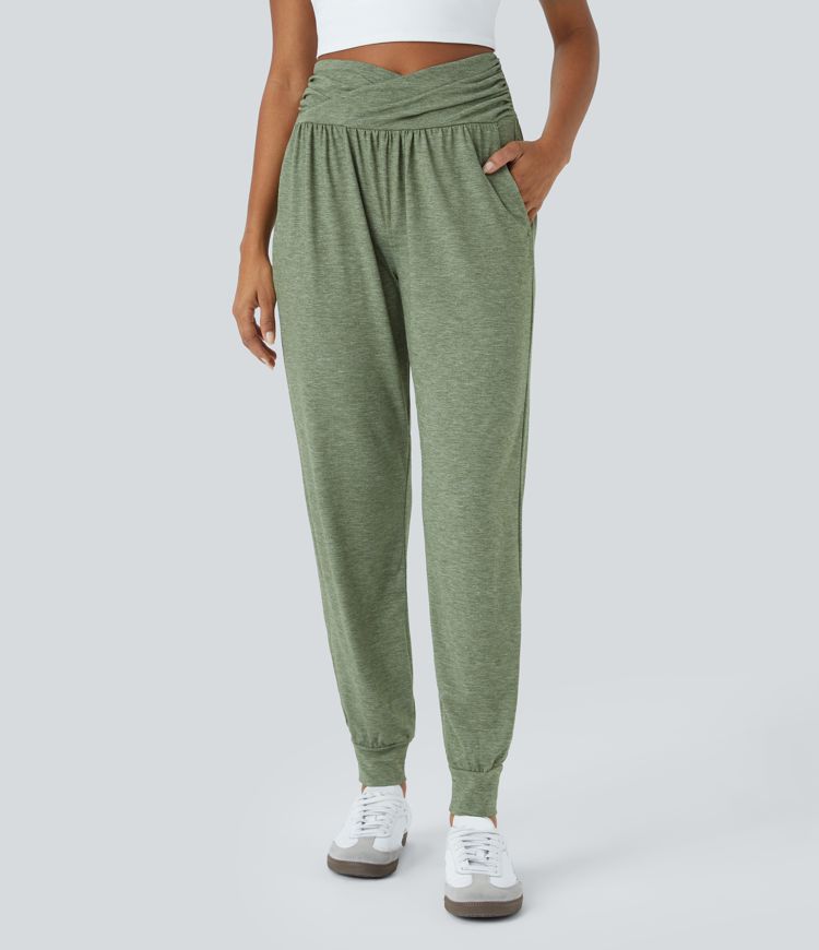 Pantalón deportivo tiro alto bolsillo lateral cruzado pliegue