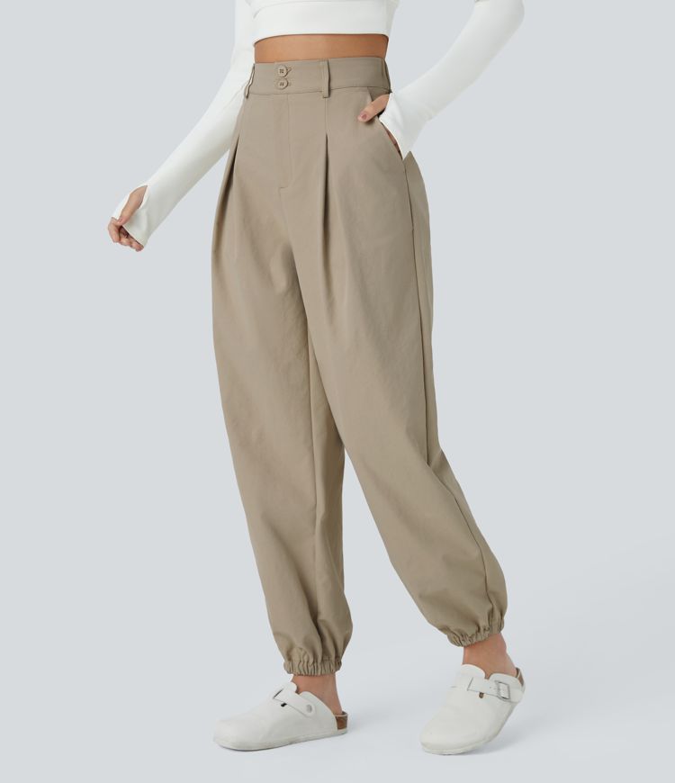 Pantalón chándal tiro alto cremallera botón bolsillo lateral plisado