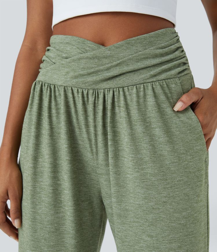 Pantalón deportivo tiro alto bolsillo lateral cruzado pliegue