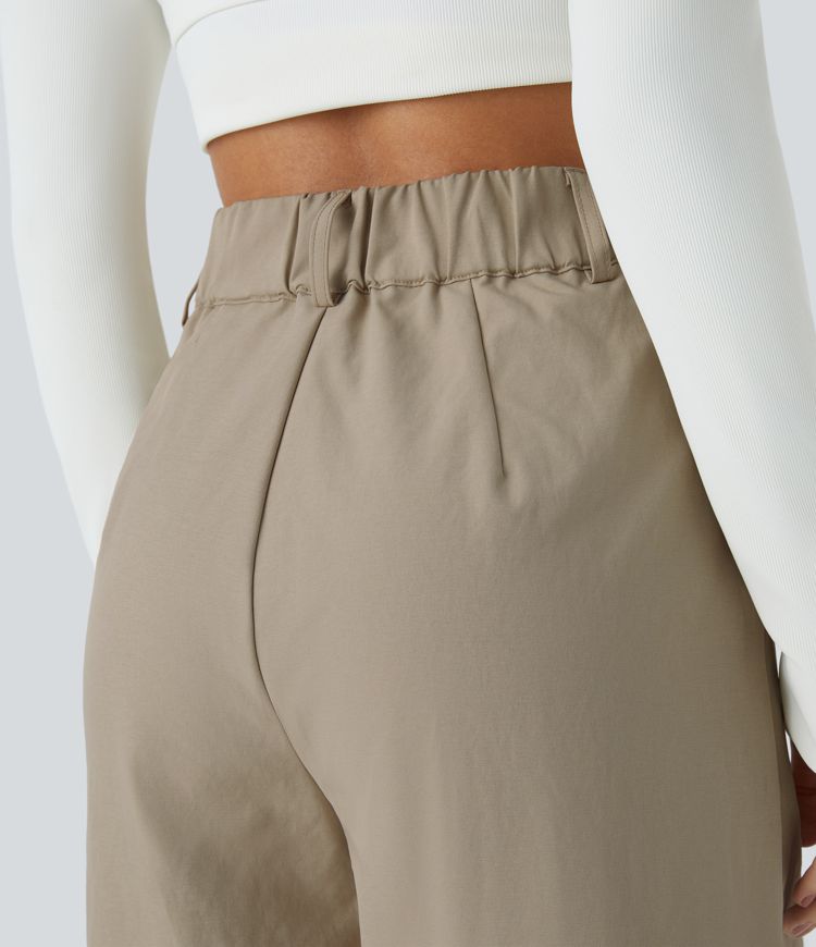 Pantalón chándal tiro alto cremallera botón bolsillo lateral plisado