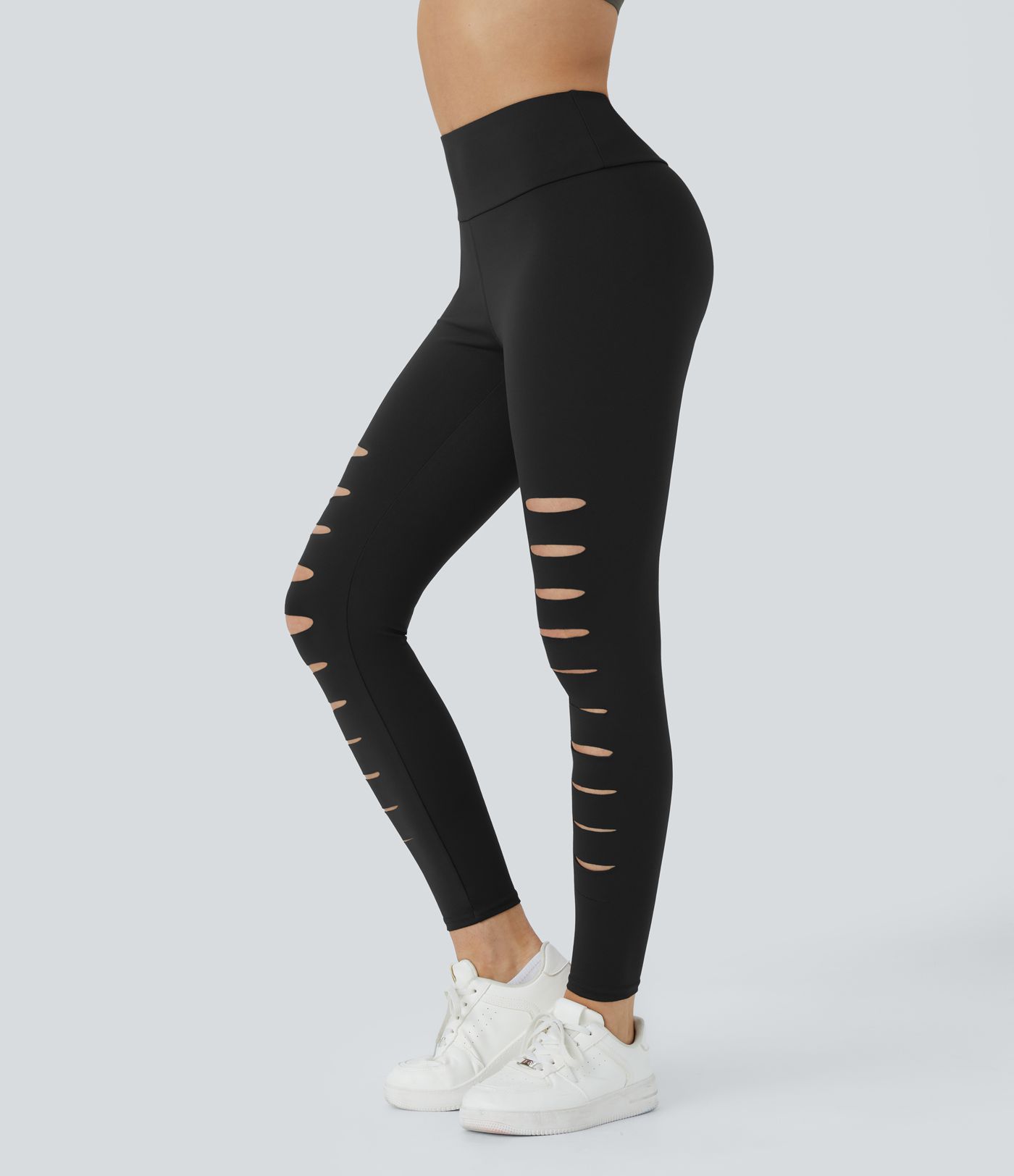 Leggings rasgados con agujeros de tiro alto