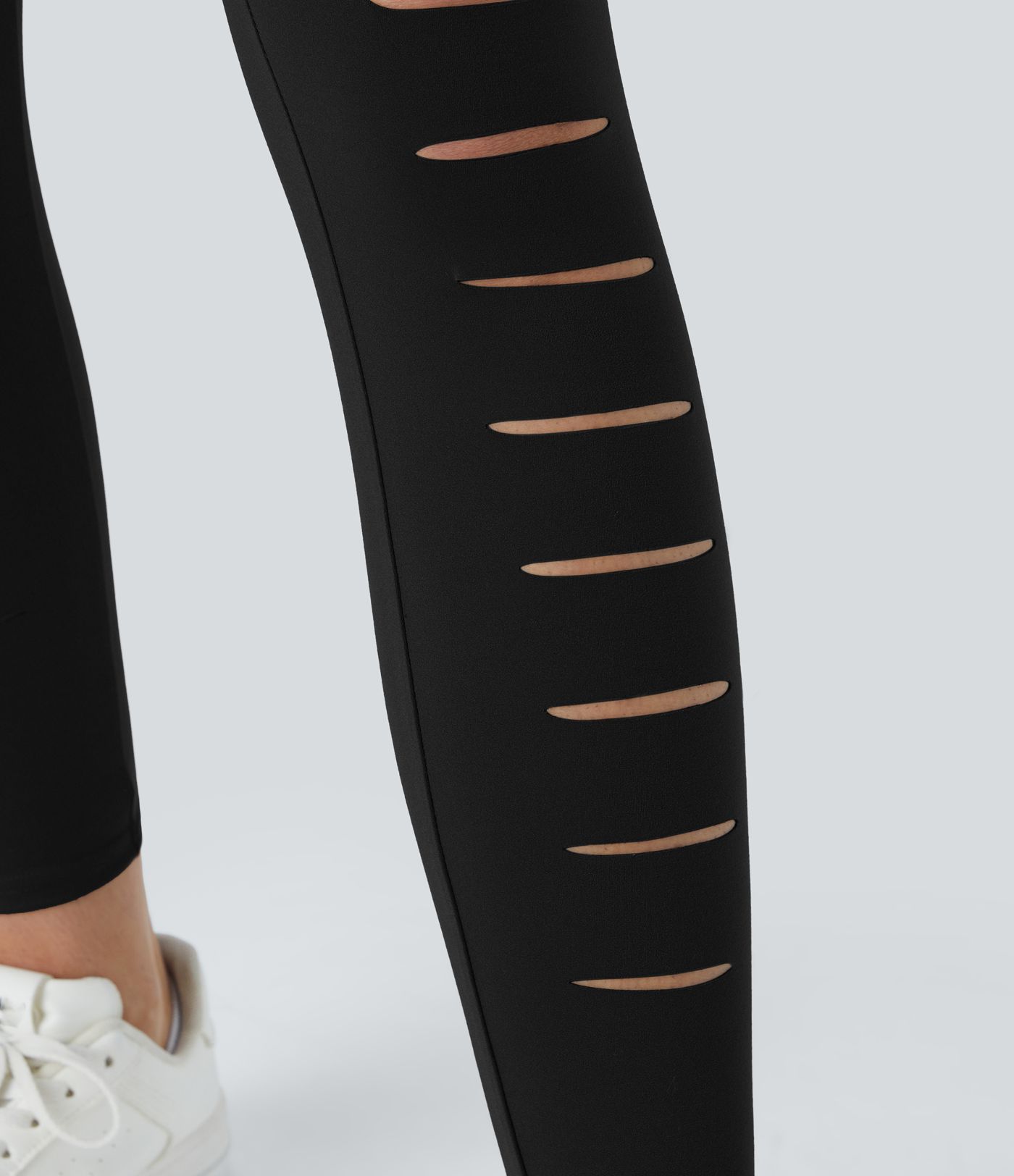 Leggings rasgados con agujeros de tiro alto