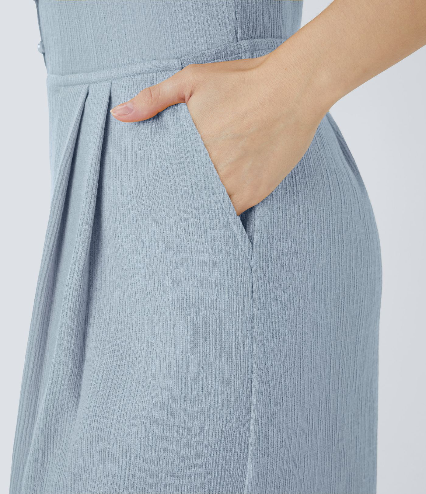 Casual flared jumpsuit with V-neck, double straps, buttons and side pockets