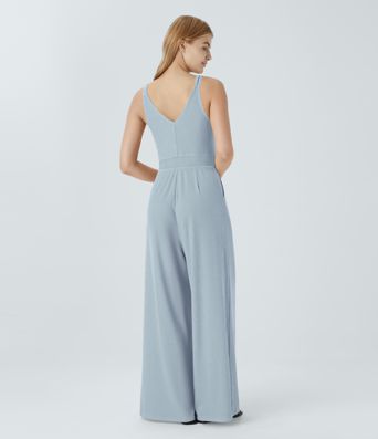 Casual flared jumpsuit with V-neck, double straps, buttons and side pockets