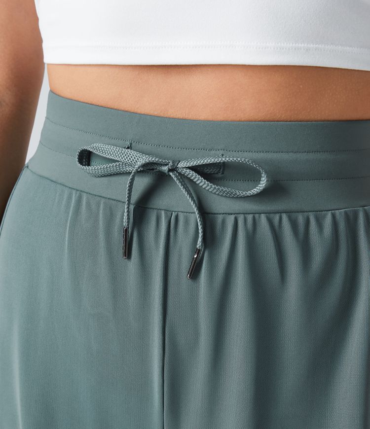 Pantalón yoga fluido pierna ancha bolsillo lateral 2 en 1 abertura malla contrastante cordón tiro alto