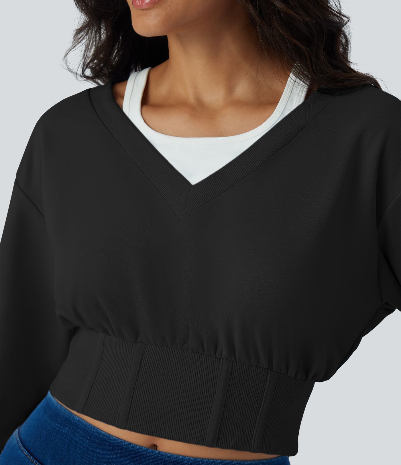 Sudadera corta corsé manga larga bloque color