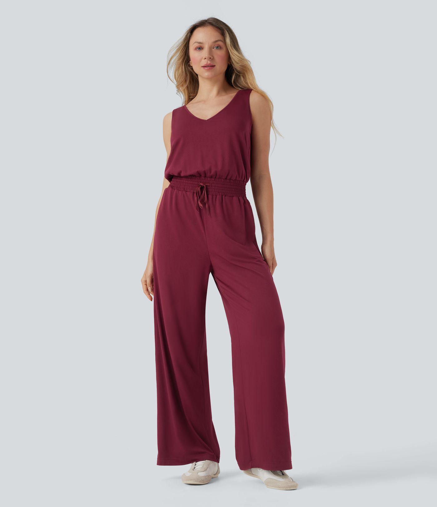 Lässiger, rückenfreier, ärmelloser Jumpsuit mit Seitentaschen, Wasserfallausschnitt und Kordelzug