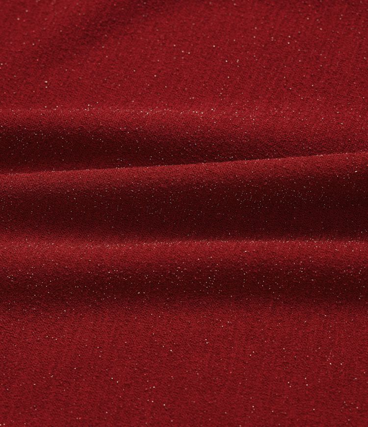 Top de cuello redondo de manga larga con acabado metálico