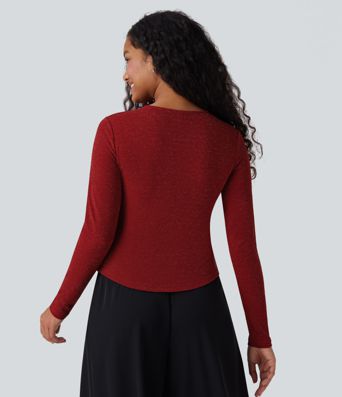 Top de cuello redondo de manga larga con acabado metálico