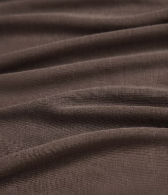 Laisvas vilnonis viršus su apvalia iškirpte ir ilgomis rankovėmis