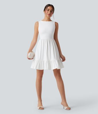 Mini dress with boat neck, low back, and bow