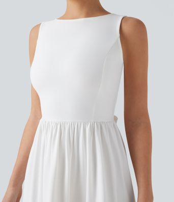 Mini dress with boat neck, low back, and bow