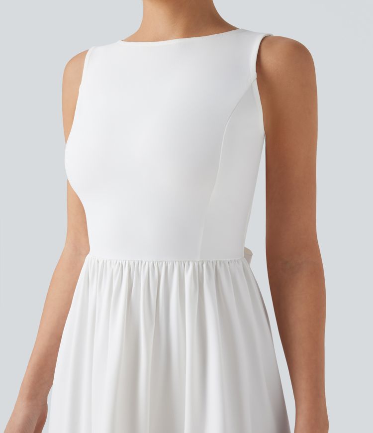 Mini dress with boat neck, low back, and bow