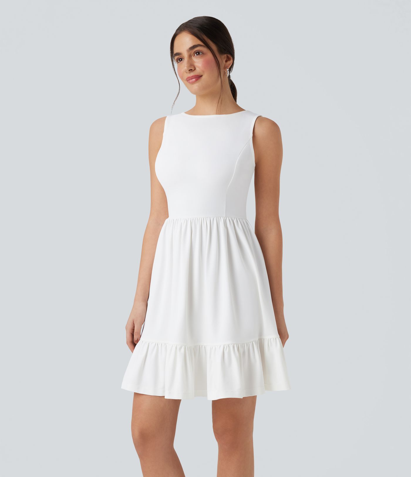 Mini dress with boat neck, low back, and bow