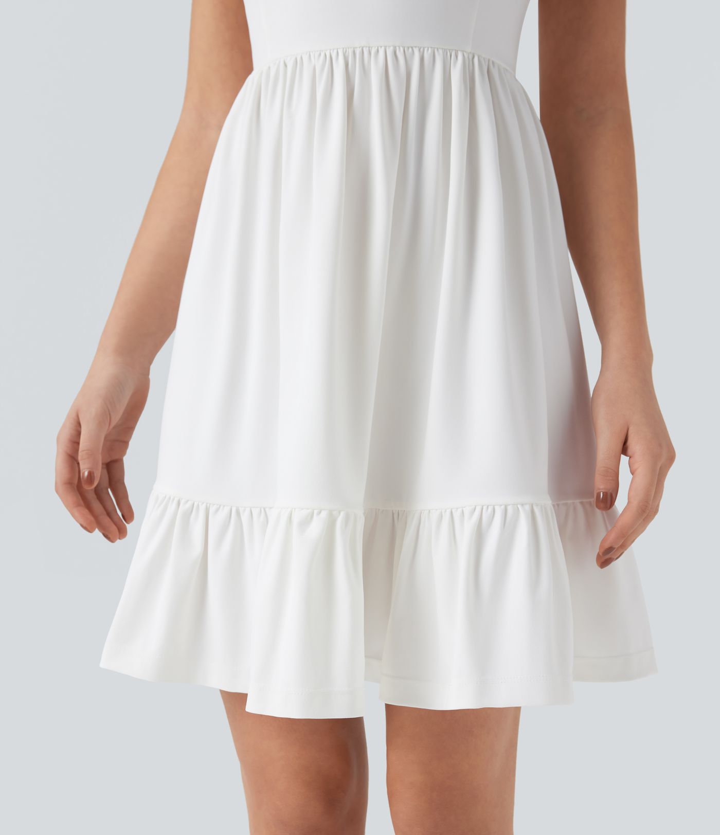 Mini dress with boat neck, low back, and bow