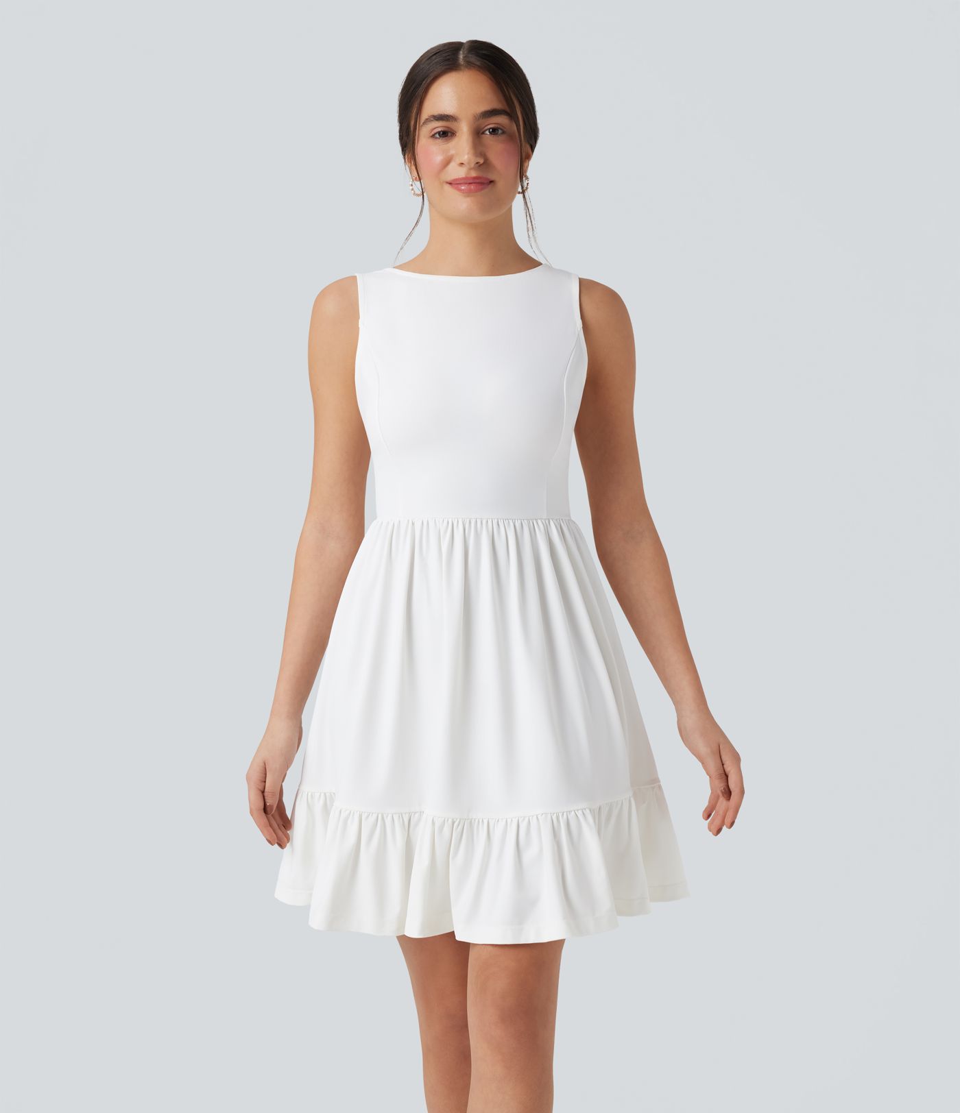 Mini dress with boat neck, low back, and bow