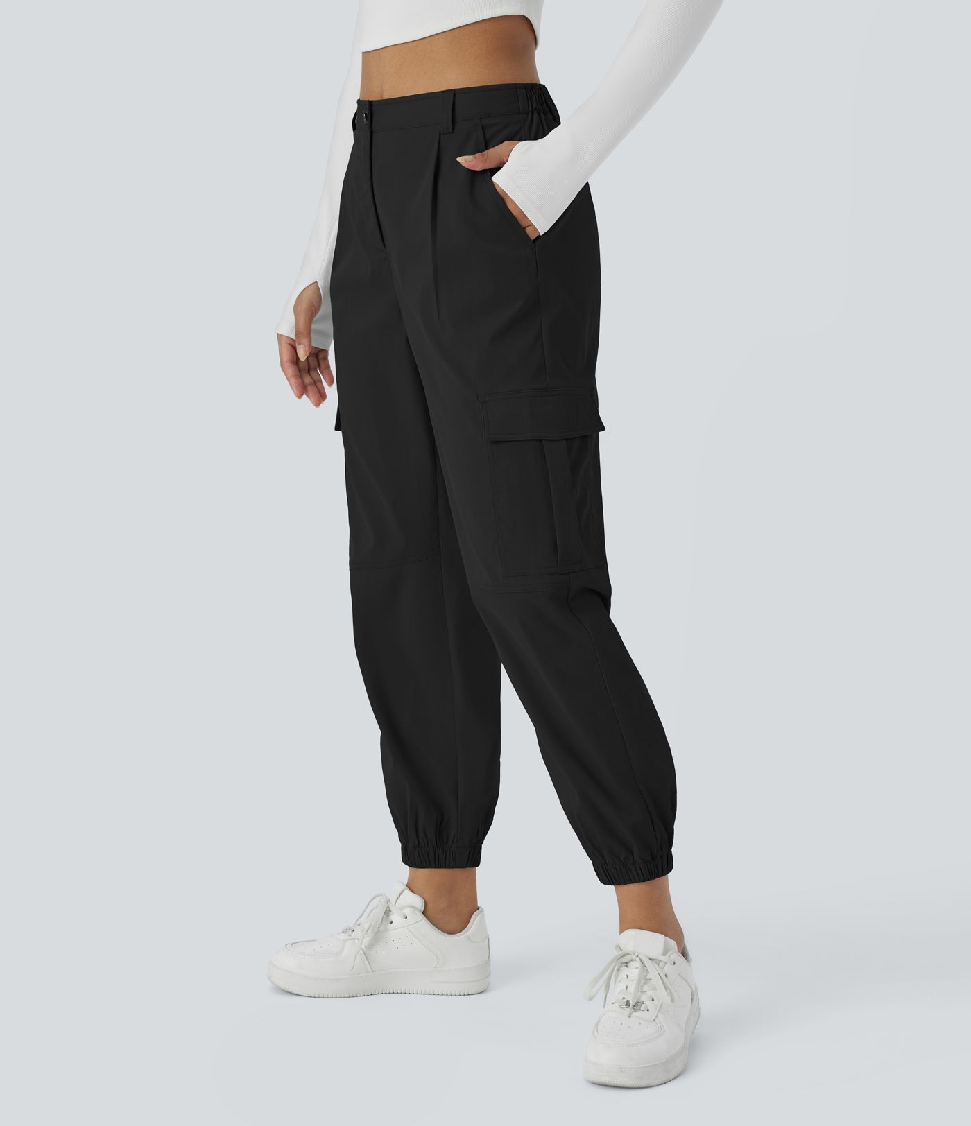 Casual cargo jogging pants with mid-rise waist, button closure, and multiple pockets
