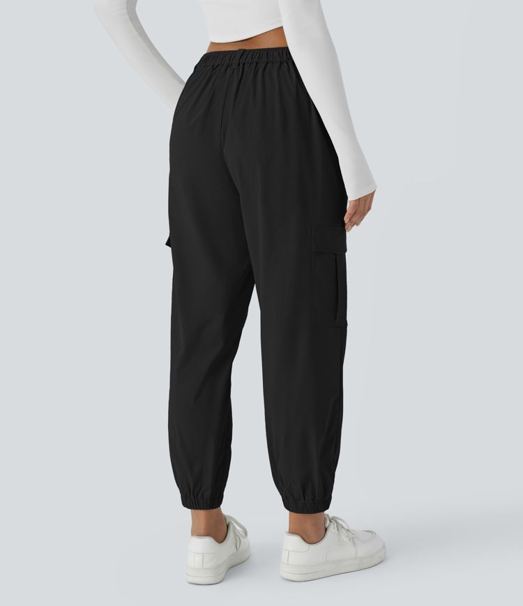 Casual cargo jogging pants with mid-rise waist, button closure, and multiple pockets