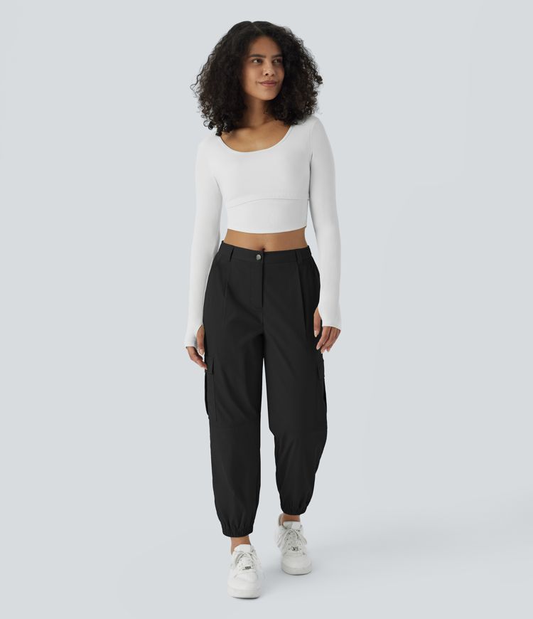 Casual cargo jogging pants with mid-rise waist, button closure, and multiple pockets