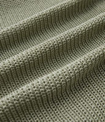 Jersey casual oversize de un hombro con media manga, abertura en el bajo y bolsillo