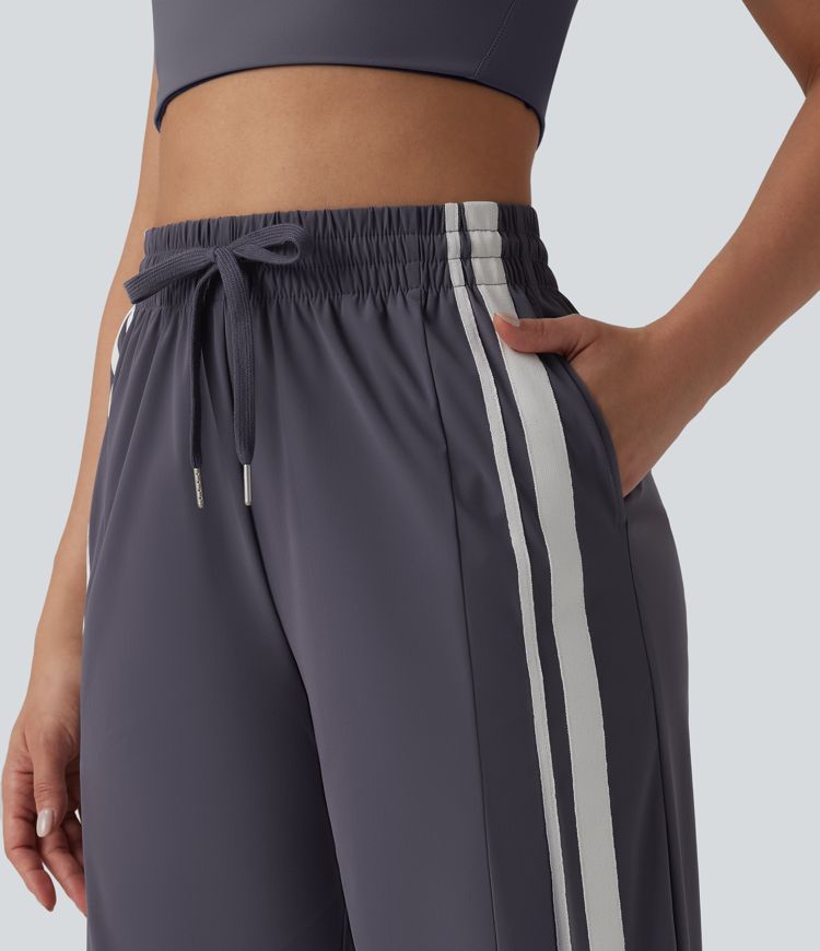 Workout-Cargo-Hose mit hohem Bund, mehreren Taschen, Kordelzug, Streifen und Farbblock - schnelltrocknend