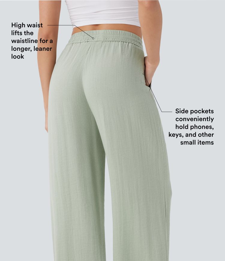 Aukšto liemens platėjančios kelnės su raišteliu ir kišenėmis, primenančios lino audinį