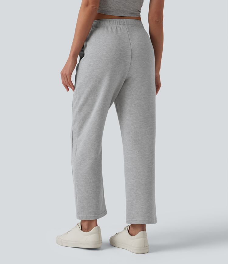 Lässige, schmal zulaufende Baumwoll-Jogginghose mit mittelhohem Bund, Seitentaschen und Kordelzug