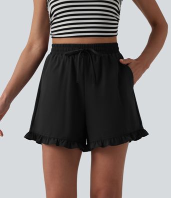 Kõrge vöökohaga, paelaga laiad vabaajashortsid volangiga ääre ja taskutega