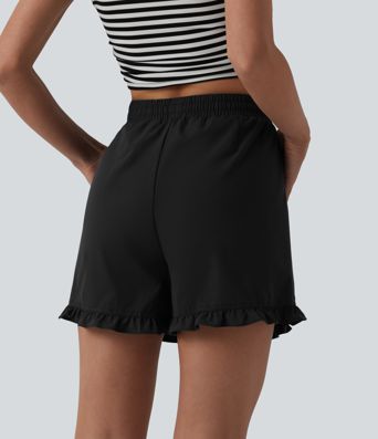 Kõrge vöökohaga, paelaga laiad vabaajashortsid volangiga ääre ja taskutega