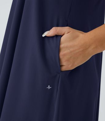 Breezeful™ Rückenfreies, fließendes Midi-Freizeitkleid mit Racerback, Seitentaschen und High-Low-Design - schnelltrocknend Breezeful™ Rückenfreies, fließendes Midi-Freizeitkleid mit Racerback, Seitentaschen und High-Low-Design - schnelltrocknend