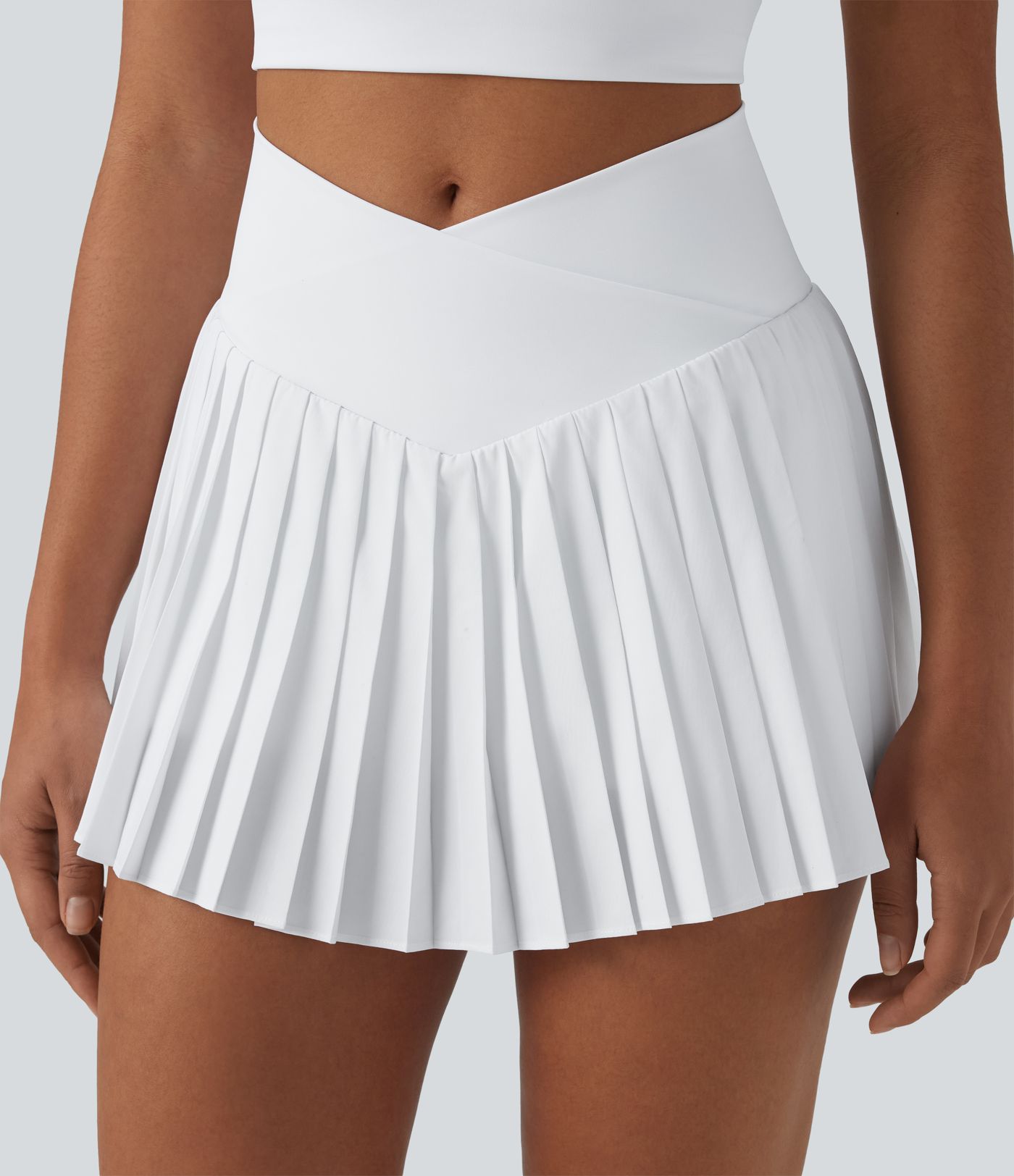 Breezeful™ Jupe-short tennis mini 2-en-1 plissée séchage rapide taille haute croisée avec poches