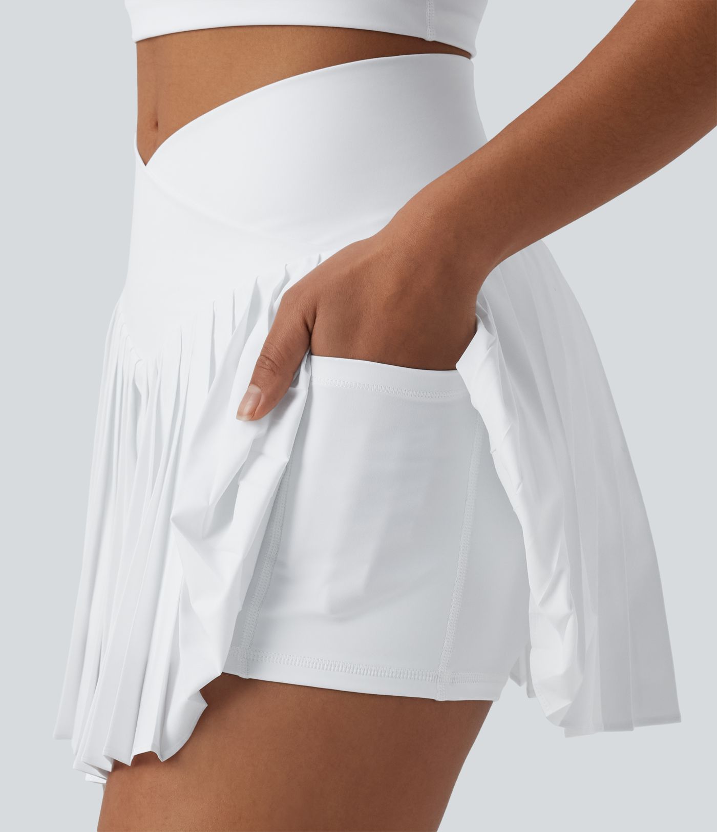 Breezeful™ Jupe-short tennis mini 2-en-1 plissée séchage rapide taille haute croisée avec poches