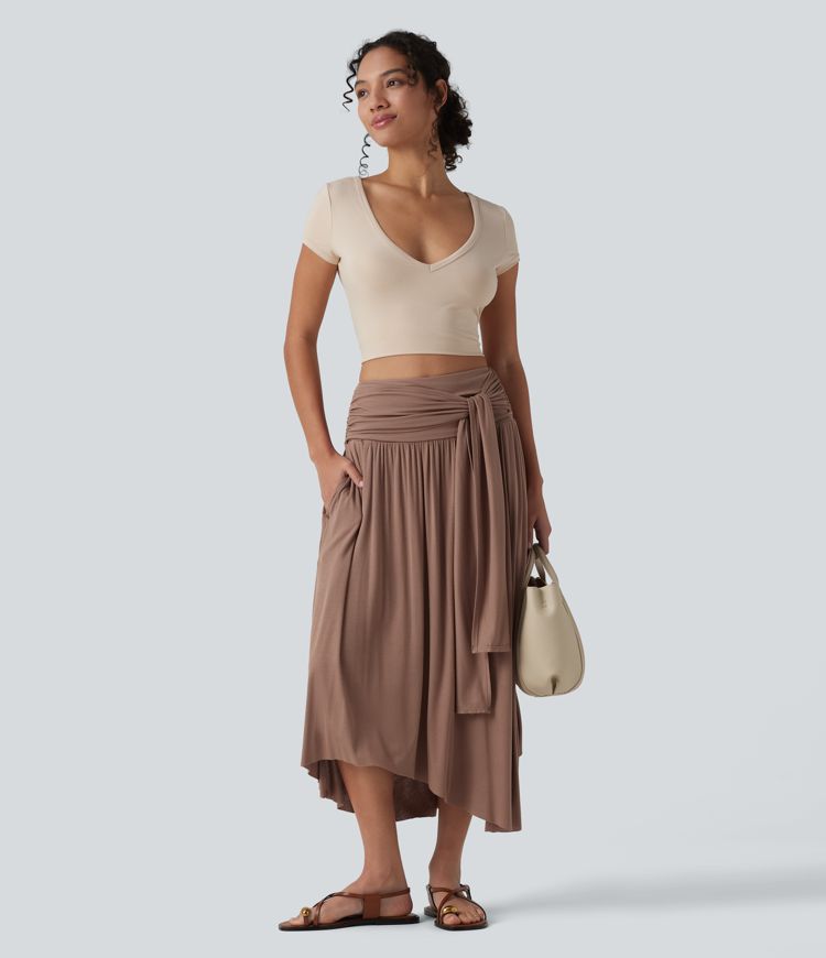 Jupe midi fluide casual gainante côtelée taille haute à nœuds latéraux et ourlet asymétrique avec poches
