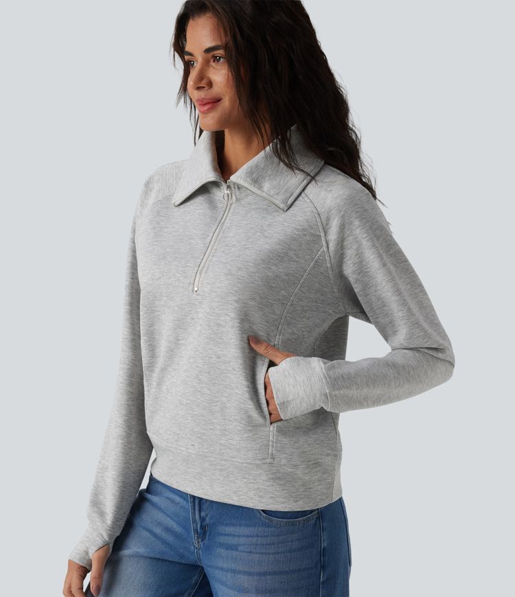 Felpa casual con collo a rever e mezza zip, maniche lunghe, apertura per i pollici e tasche