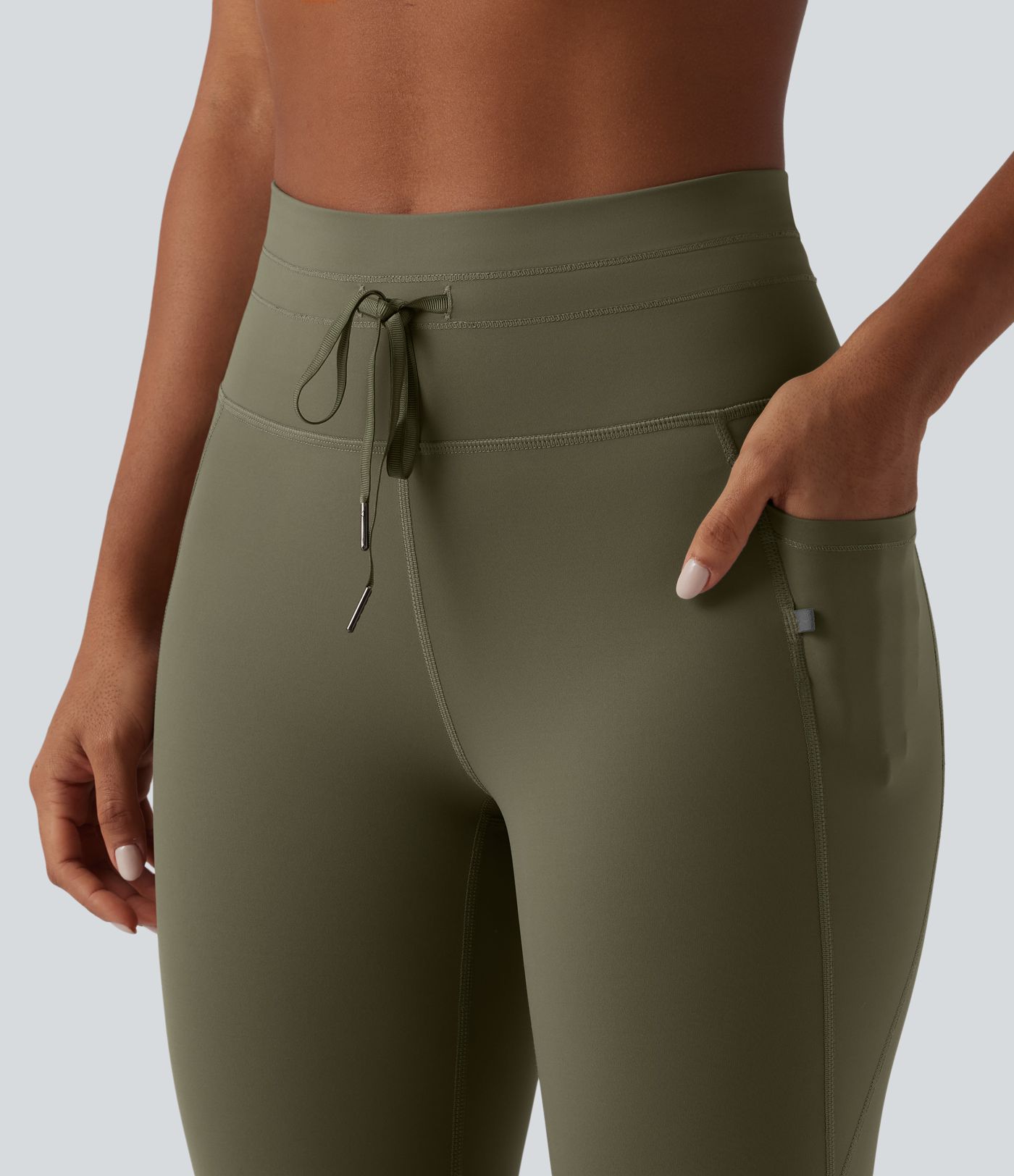 Gładkie legginsy do jogi 7/8 z wysokim stanem, sznurkiem w pasie i kieszeniami