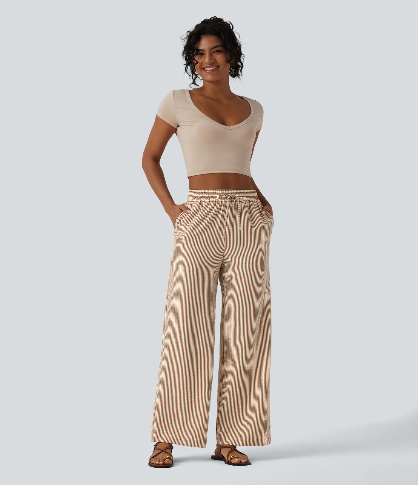 Hoch geschnittene, gestreifte, leinenähnliche, lässige weite Hose mit Kordelzug und Taschen