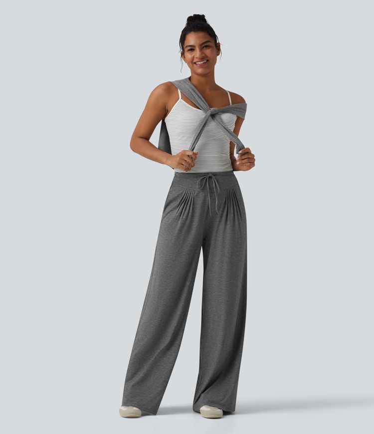 Pantalones casuales anchos de talle alto con cordón, plisados, de tejido jaspeado y con bolsillos.