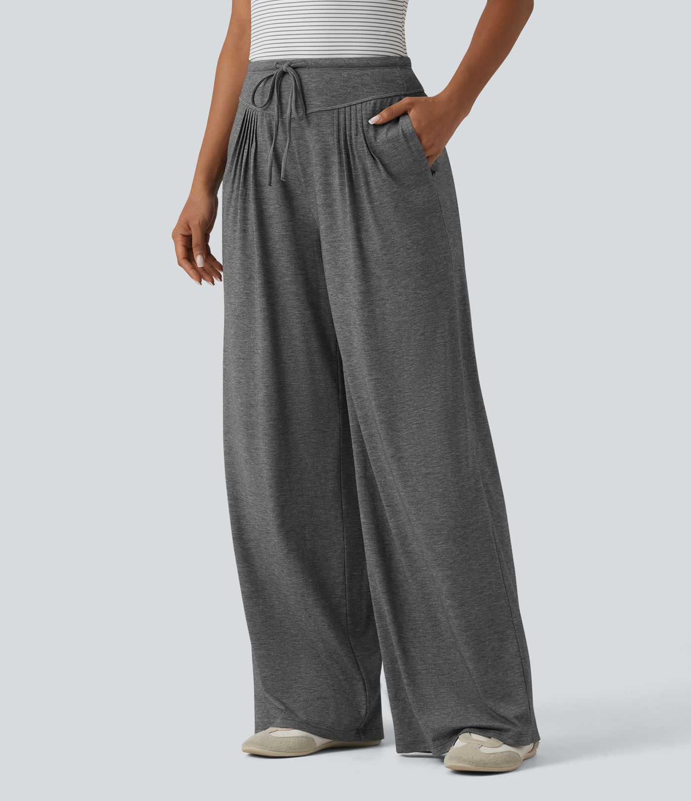 Pantalones casuales anchos de talle alto con cordón, plisados, de tejido jaspeado y con bolsillos.