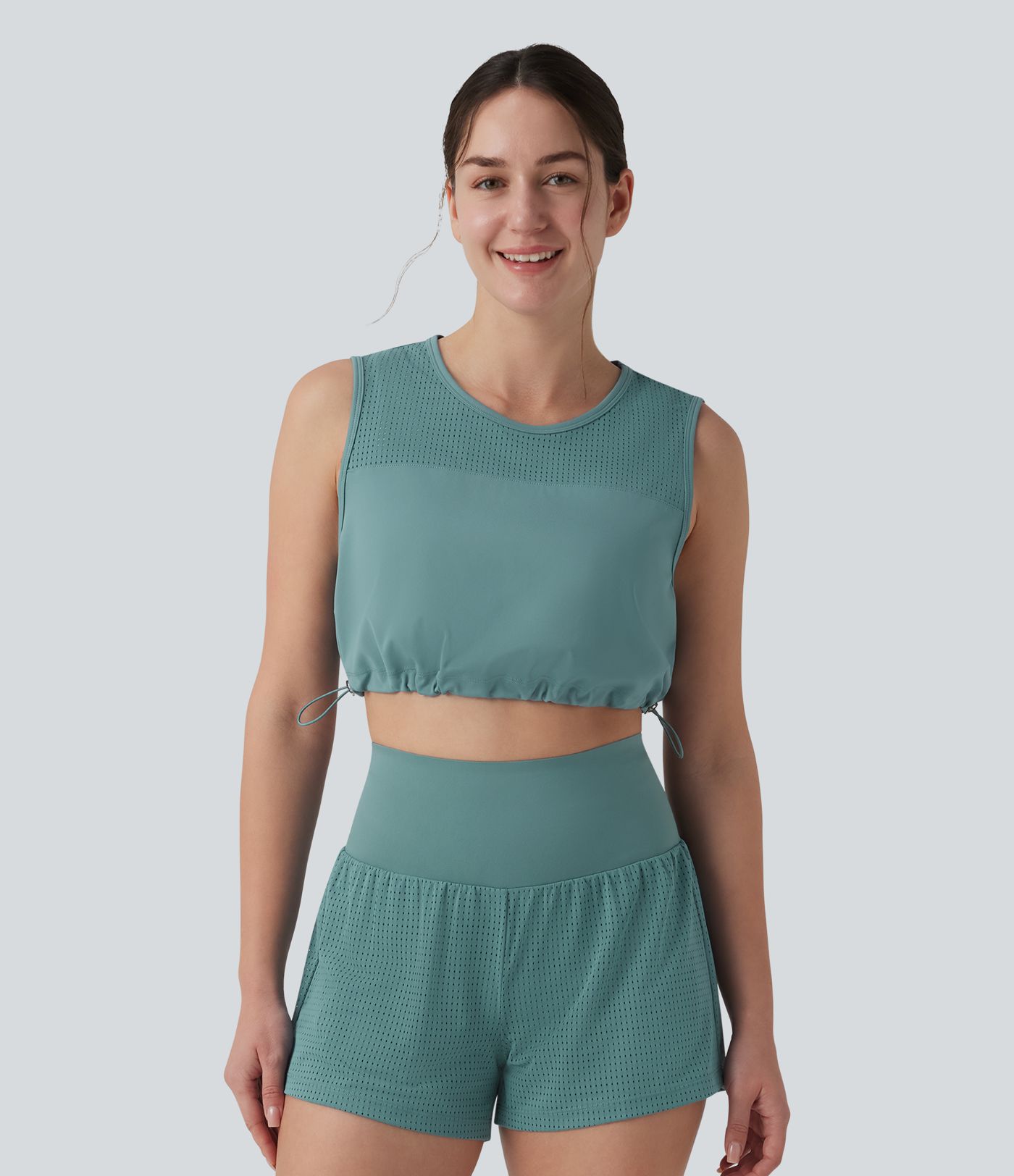 Kurzes Yoga-Tanktop mit Rundhalsausschnitt, Kordelzug und atmungsaktivem Netzgewebe