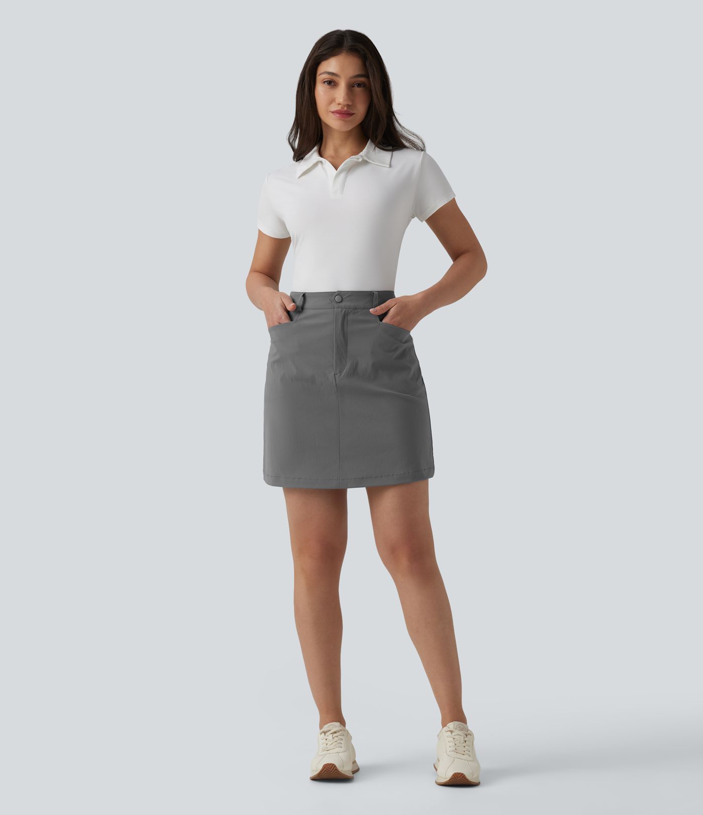 Mini-jupe de golf taille haute, coupé trapèze, avec poches — longueur allongée