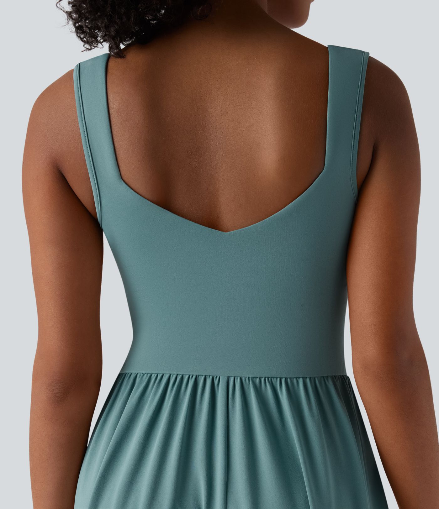 Robe décontractée midi fluide sans manches dos croisé ouvert avec poches