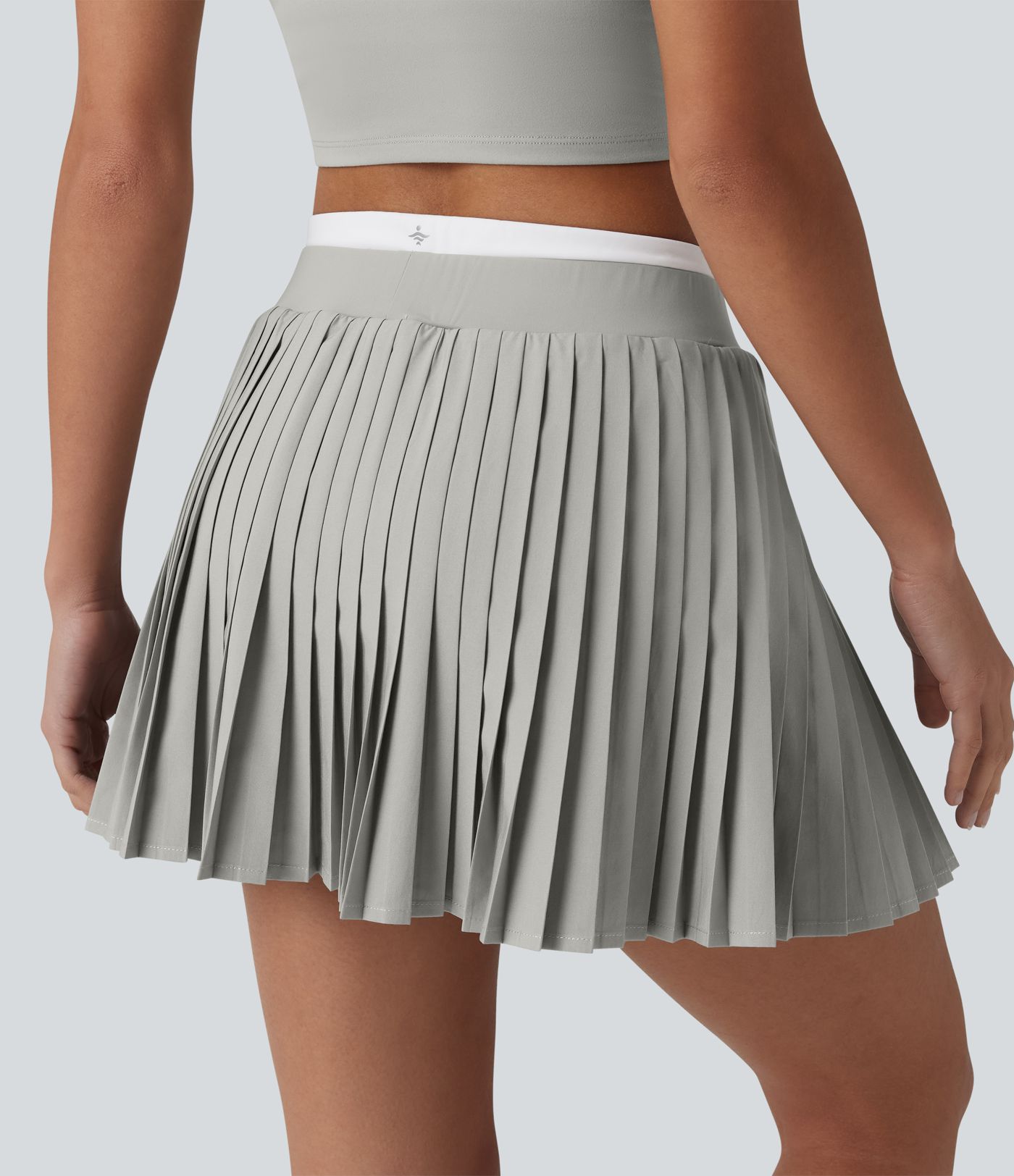 Jupe mini de tennis plissée 2-en-1 Breezeful™ color block taille haute à séchage rapide avec poches