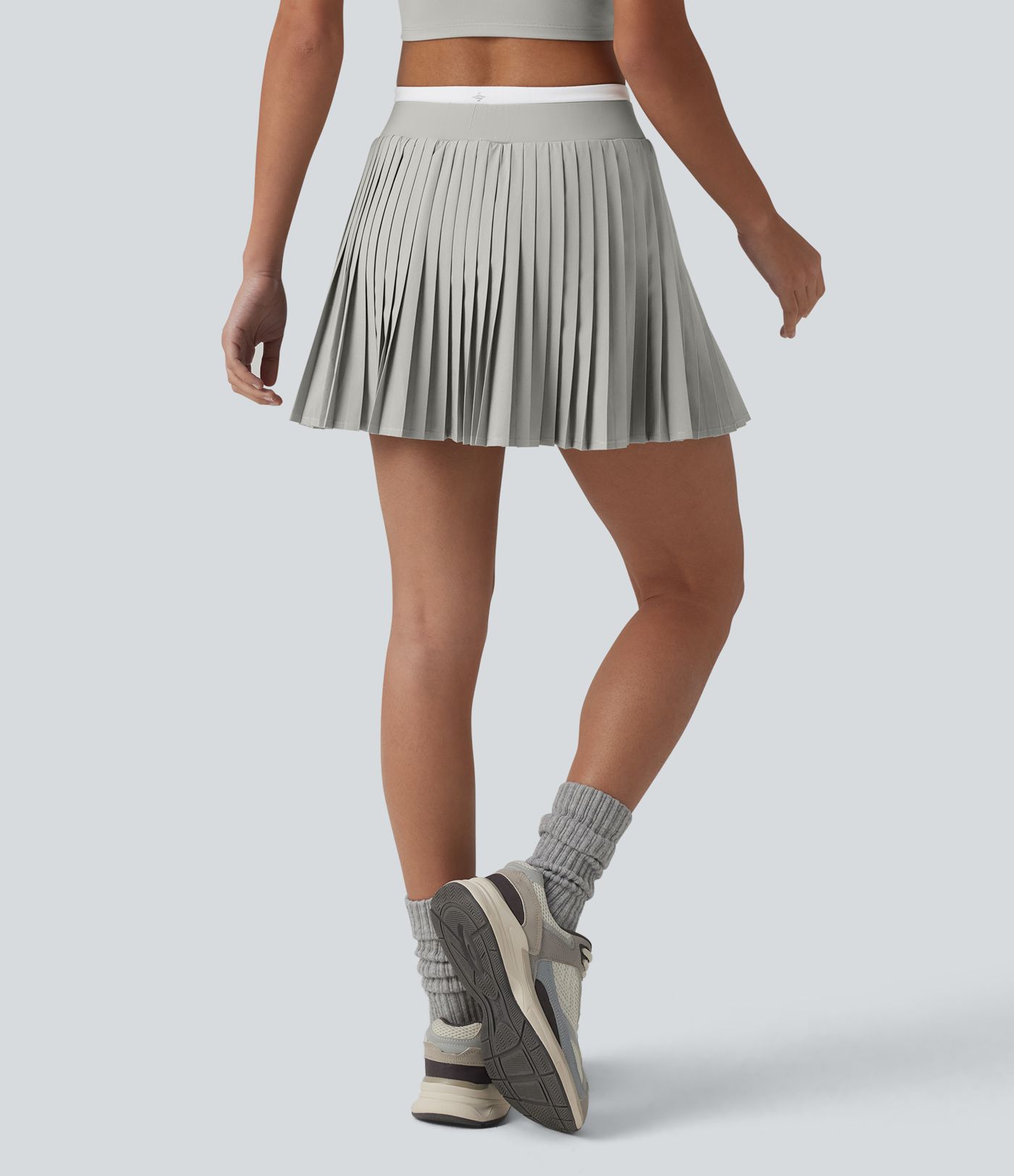 Jupe mini de tennis plissée 2-en-1 Breezeful™ color block taille haute à séchage rapide avec poches