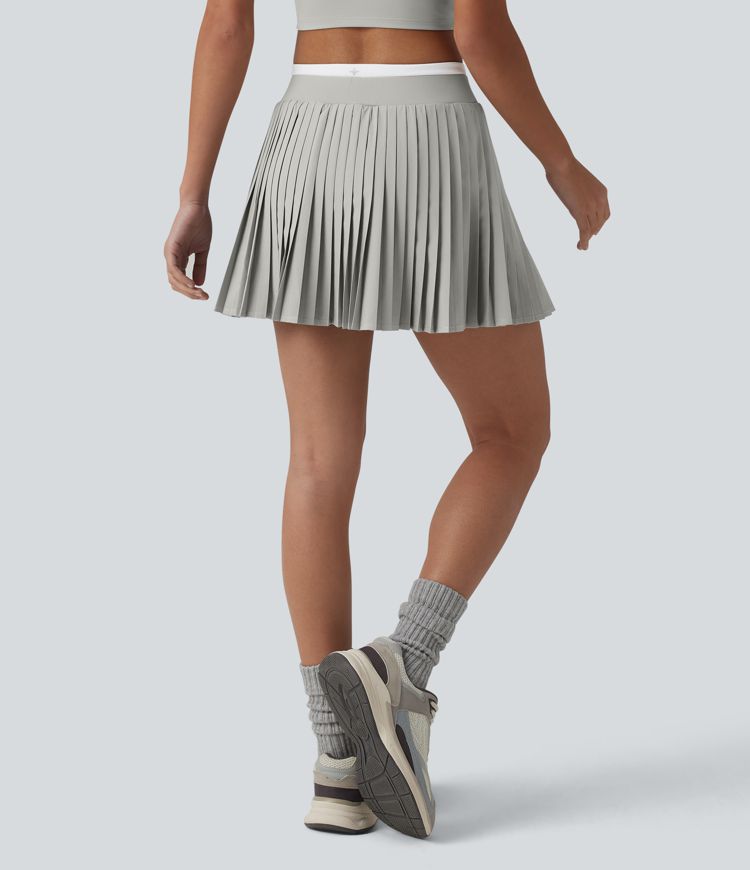 Jupe mini de tennis plissée 2-en-1 Breezeful™ color block taille haute à séchage rapide avec poches