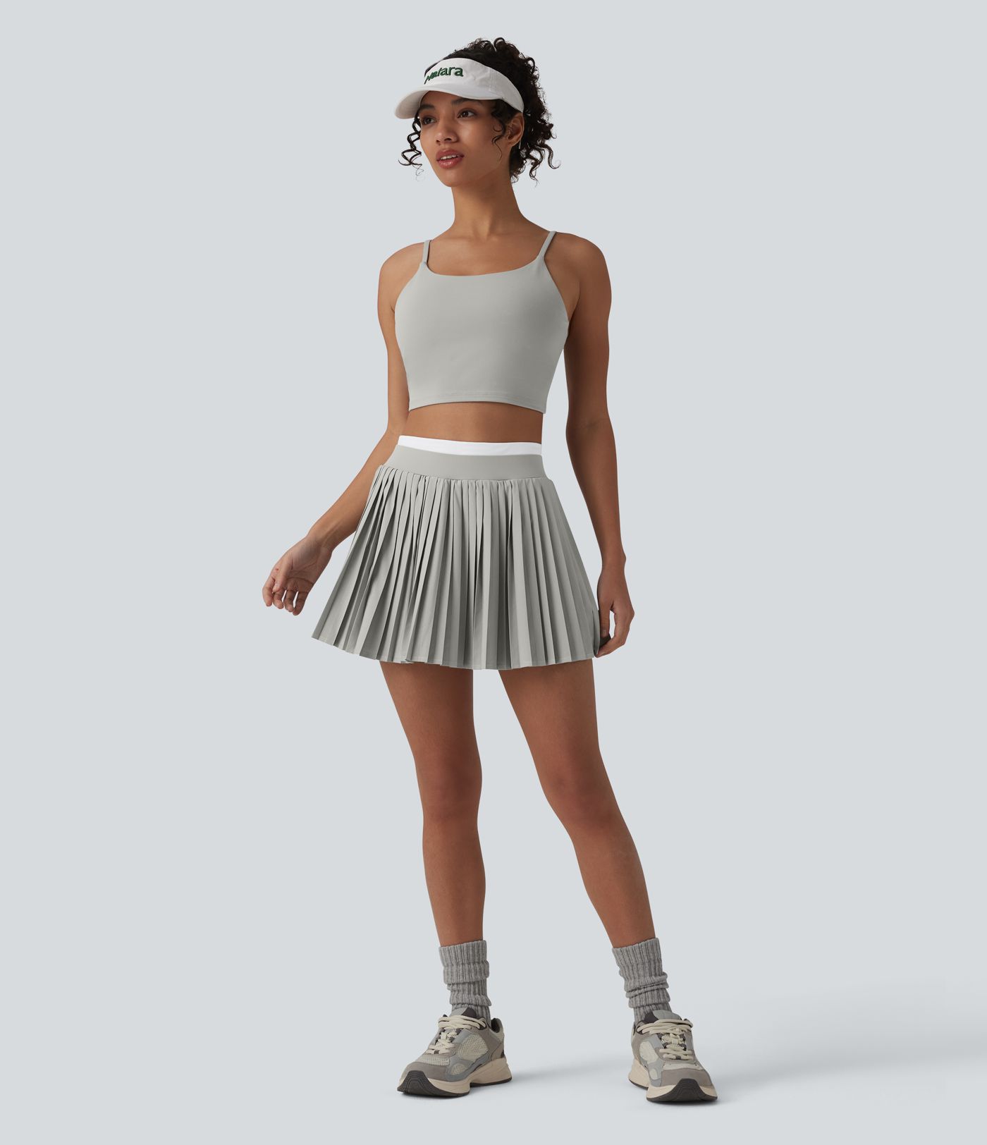 Jupe mini de tennis plissée 2-en-1 Breezeful™ color block taille haute à séchage rapide avec poches