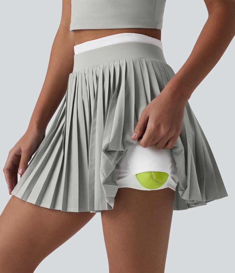 Jupe mini de tennis plissée 2-en-1 Breezeful™ color block taille haute à séchage rapide avec poches
