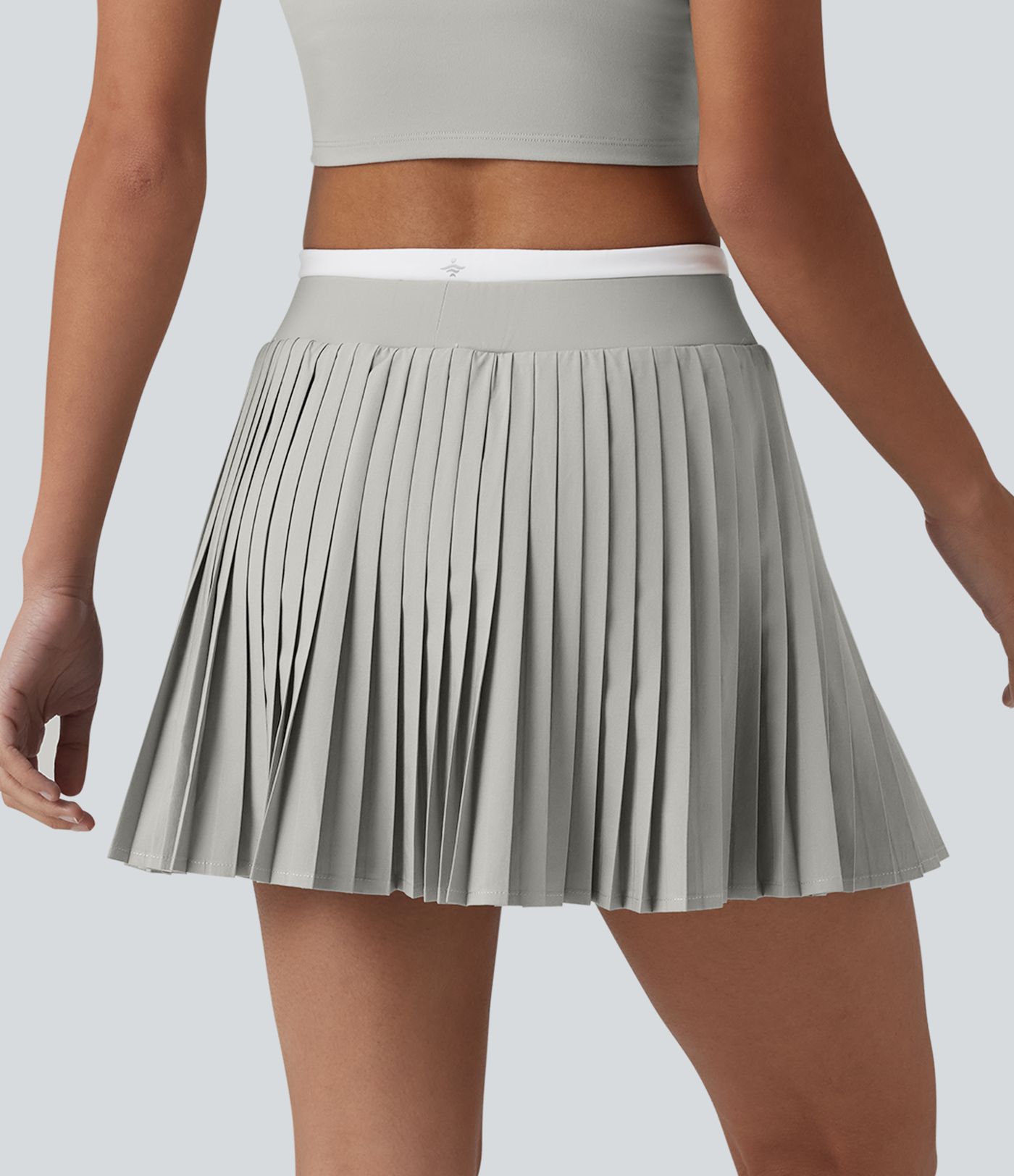 Jupe mini de tennis plissée 2-en-1 Breezeful™ color block taille haute à séchage rapide avec poches